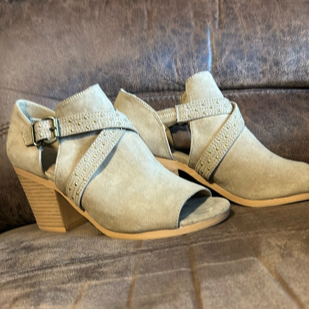 Tan peep toe booties.